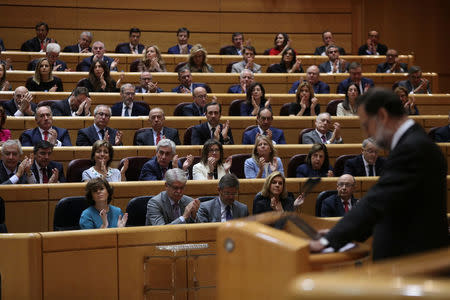 People's Party (PP) senators and members of government applaud as Spain's Prime Minister Mariano Rajoy pauses his speech during a debate at the upper house Senate in Madrid, Spain, October 27, 2017. REUTERS/Susana Vera