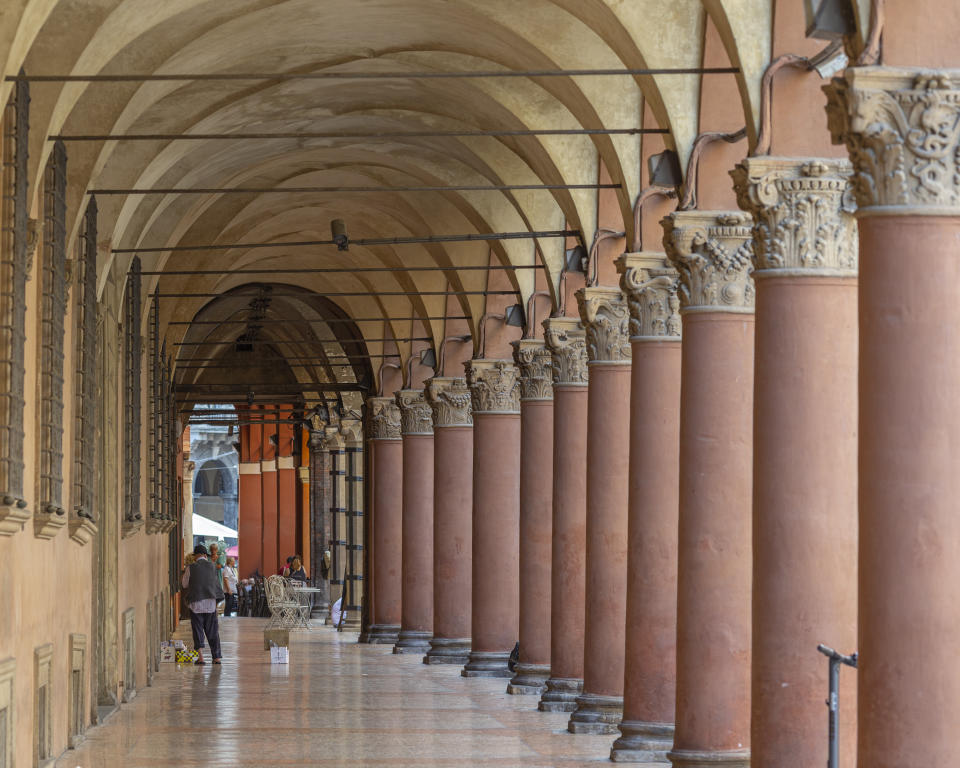 A view of Bologna's porticoes in Bologna, Italy, Wednesday, July 28, 2021. Bologna's 12th-century porticoes, still part of the city's everyday life, have been added to the World Heritage List. At a meeting in China on Wednesday, the World Heritage Committee of UNESCO, the U.N. culture agency, inscribed the porticoes on the prestigious list. The addition raises to 58 the number of Italian sites on the list. (Guido Calamosca/LaPresse via AP)