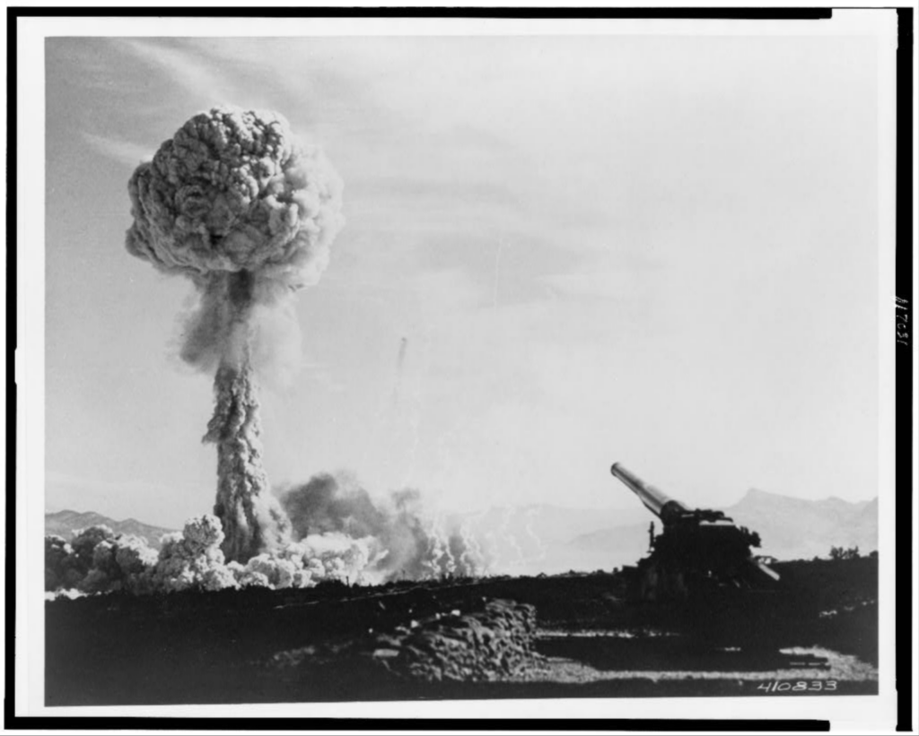 A fireball ascends from the first atomic artillery shell in history