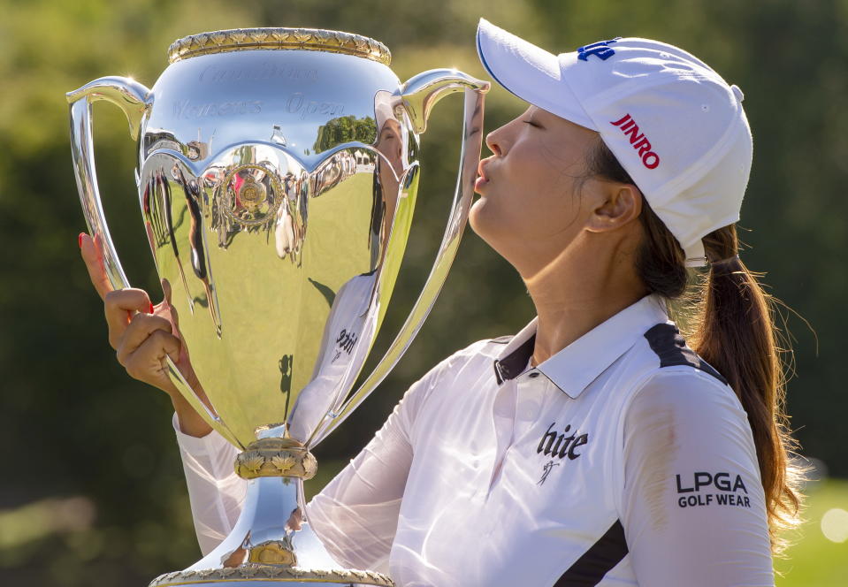 Jin Young Ko of South Korea kisses the trophy after winning the CP Women's Open in Aurora, Ontario, Sunday, Aug. 25, 2019. (Frank Gunn/The Canadian Press via AP)