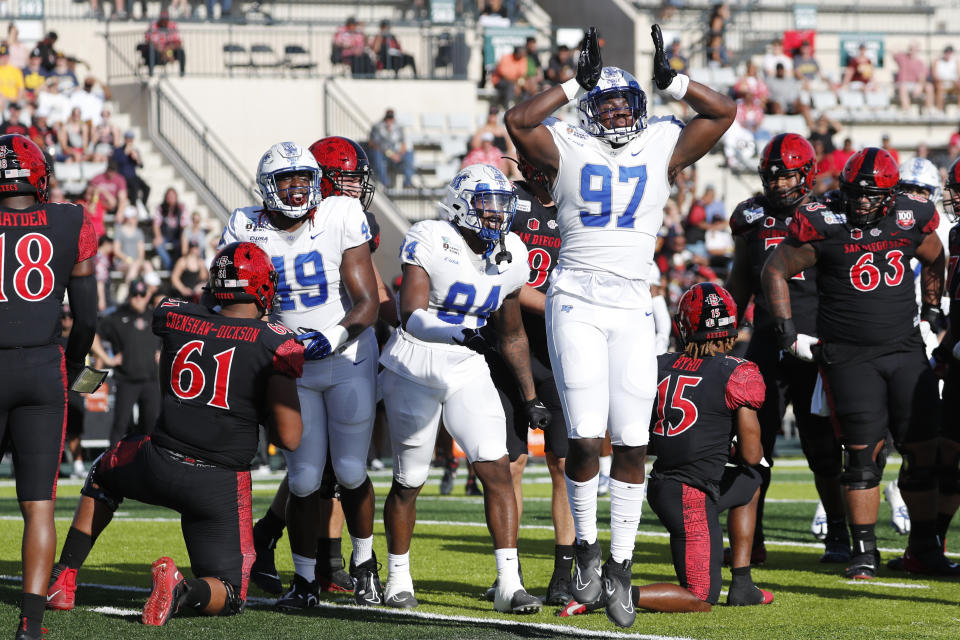 Middle Tennessee defensive end Quindarius Dunnigan (97) reacts after making a tackle against San Diego State during the first half of the Hawaii Bowl NCAA college football game, Saturday, Dec. 24, 2022, in Honolulu. (AP Photo/Marco Garcia)