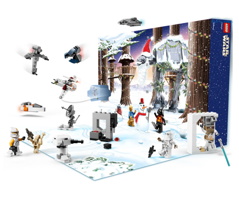 LEGO's Star Wars advent calendar on an angle displaying its Christmas-themed pieces in the air against a white background.