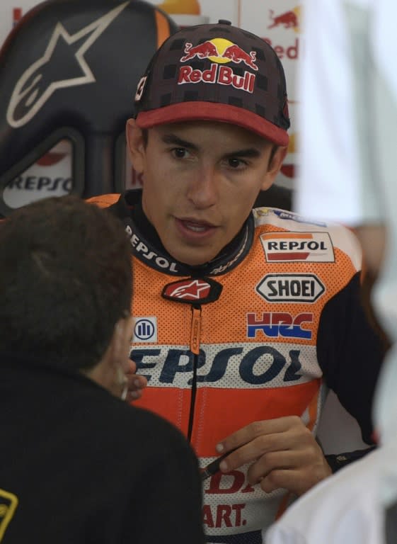 Honda biker Marc Marquez of Spain talks to mechanics at the Argentina Grand Prix at Termas de Rio Hondo circuit, in Santiago del Estero on April 8, 2017