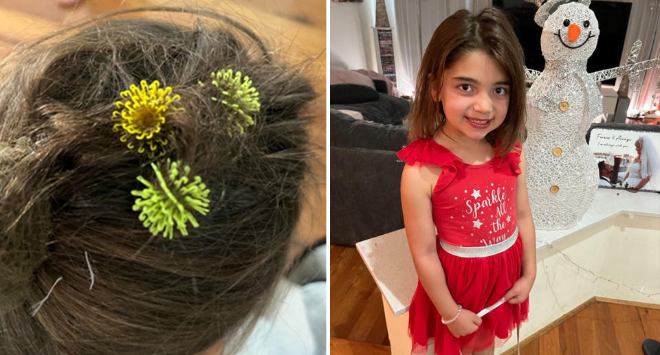 Little girl in red dress with yellow bunchems stuck in her hair