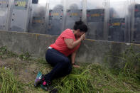 <p>An opposition supporter recovers from tear gas in Caracas, Venezuela, June 7, 2016. (Reuters/Marco Bello) </p>