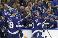 Tampa Bay Lightning right wing Nikita Kucherov, center, celebrates with teammates, including left wing Ondrej Palat (18) after being awarded a goal after a video review during the second period of an NHL hockey game against the Toronto Maple Leafs Thursday, Dec. 13, 2018, in Tampa, Fla. (AP Photo/Chris O'Meara)