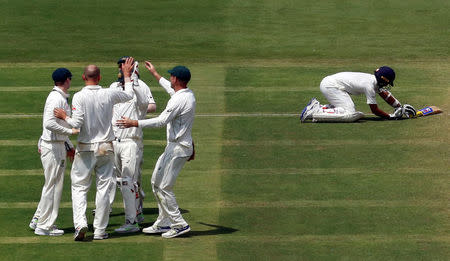 Australia's players celebrate the wicket of India's Ajinkya Rahane. REUTERS/Danish Siddiqui