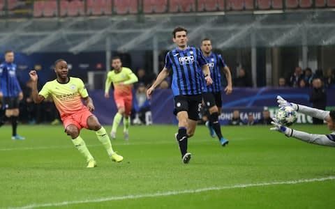 Sterling slots the ball home for the opener  - Credit: Action Images