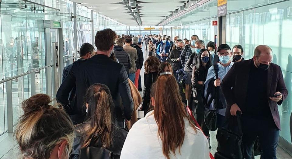 Passengers queue for the arrival hall at London Heathrow Airport (Clive Marshall/PA) (PA Wire)