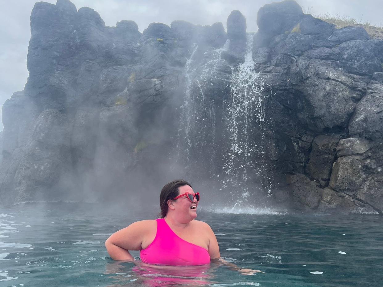 megan under the waterfall at sky lagoon