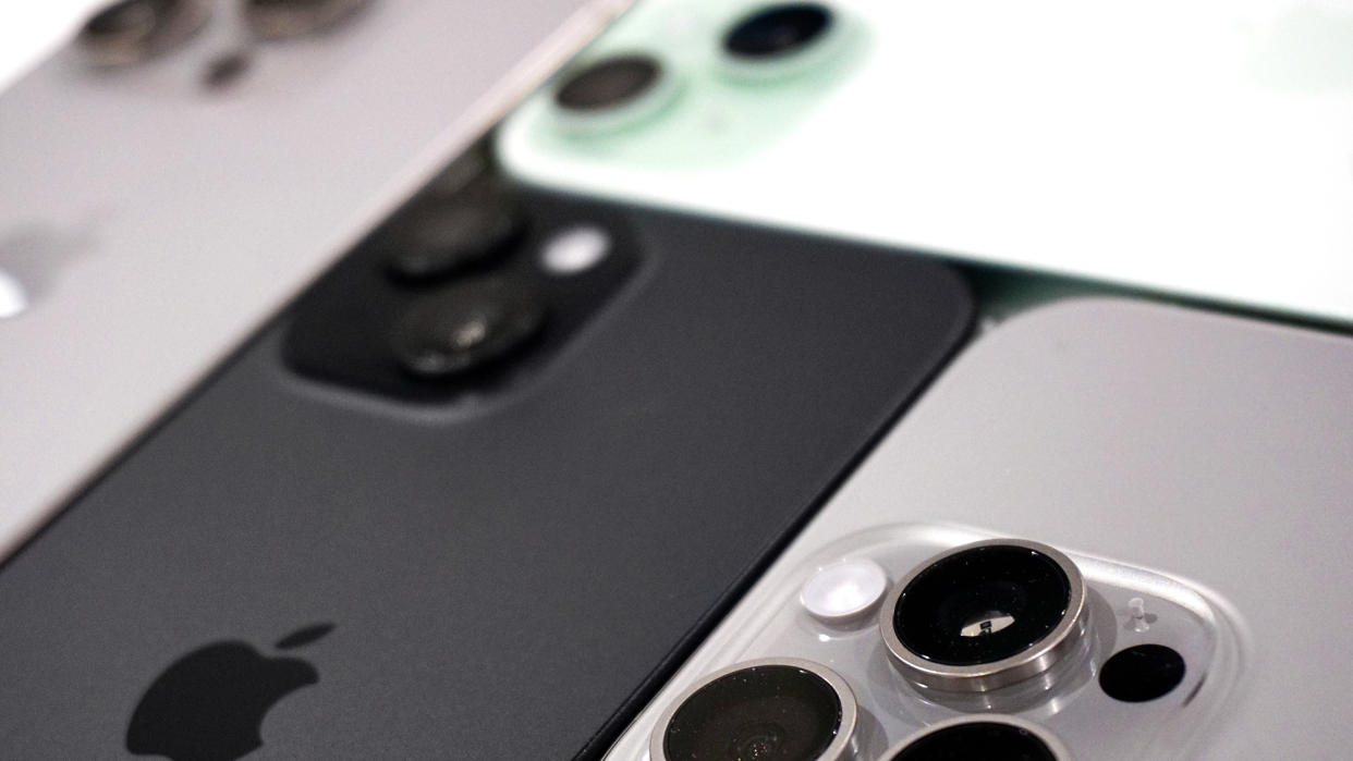  IPhone 15 family back angled closeup – darkened edit. 