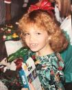 <p>Mandy was strong-armed into the permed-hair craze of the ’90s by her mom, but she confessed that the glimmers of red and green in her braces were all her. “I took full advantage of the colored rubber bands for the holidays,” she mused. (Photo: Mandy Moore via <a rel="nofollow noopener" href="https://www.instagram.com/p/BRvwQHql6Nc/?taken-by=mandymooremm&hl=en" target="_blank" data-ylk="slk:Instagram;elm:context_link;itc:0;sec:content-canvas" class="link ">Instagram</a>) </p>