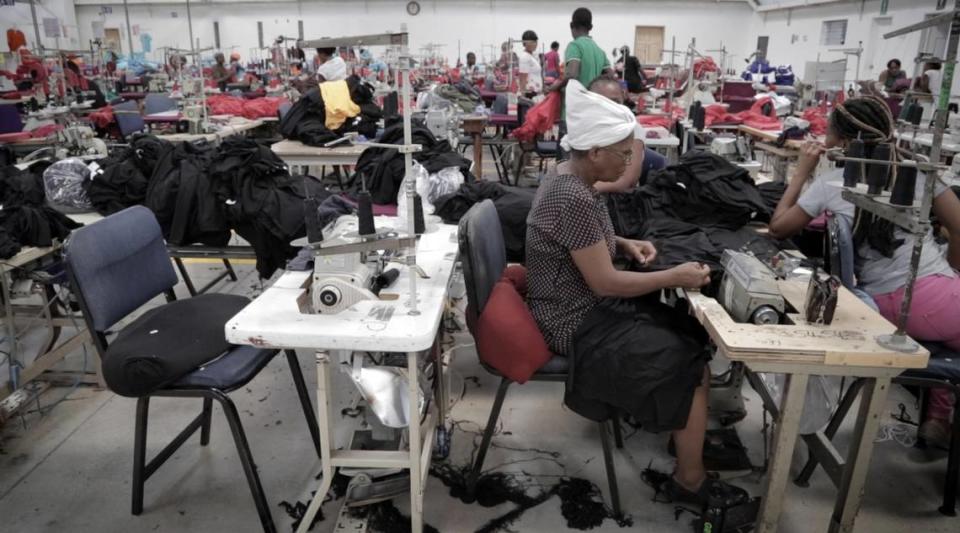 A Haitian factory worker sews at Cleveland Manufacturing in Port-au-Prince, Haiti in 2018.