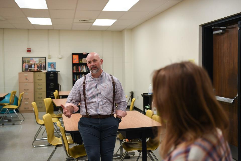 Alex Campbell stands with students in his classroom at Elizabethton High School, Thursday, April 4, 2024. In 2018, Campbell gave 20 of his students an unusual project: a cold case. Together, they were able to identify 6 Jane Does as well as the perpetrator in the case.