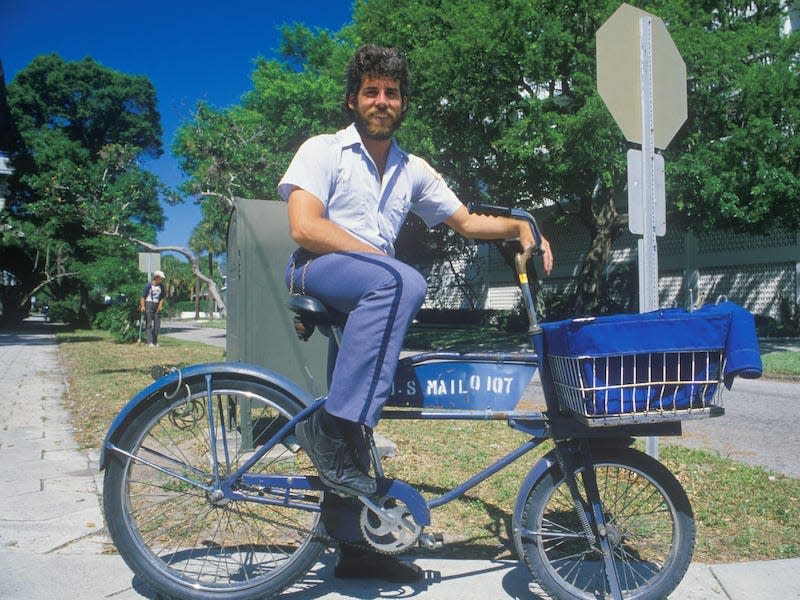 A postal worker on a bicycle in 1988