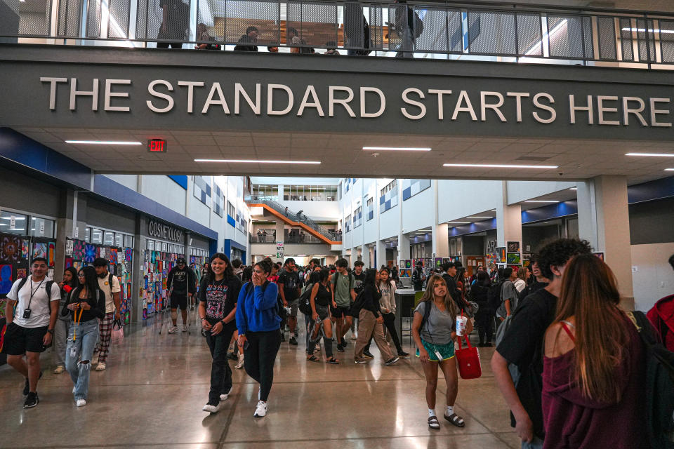 Students walk through the main hall at Moe & Gene Johnson High School in Buda. The school's operating capacity is about 2,200 students, but it currently has about 2,800 enrolled students.