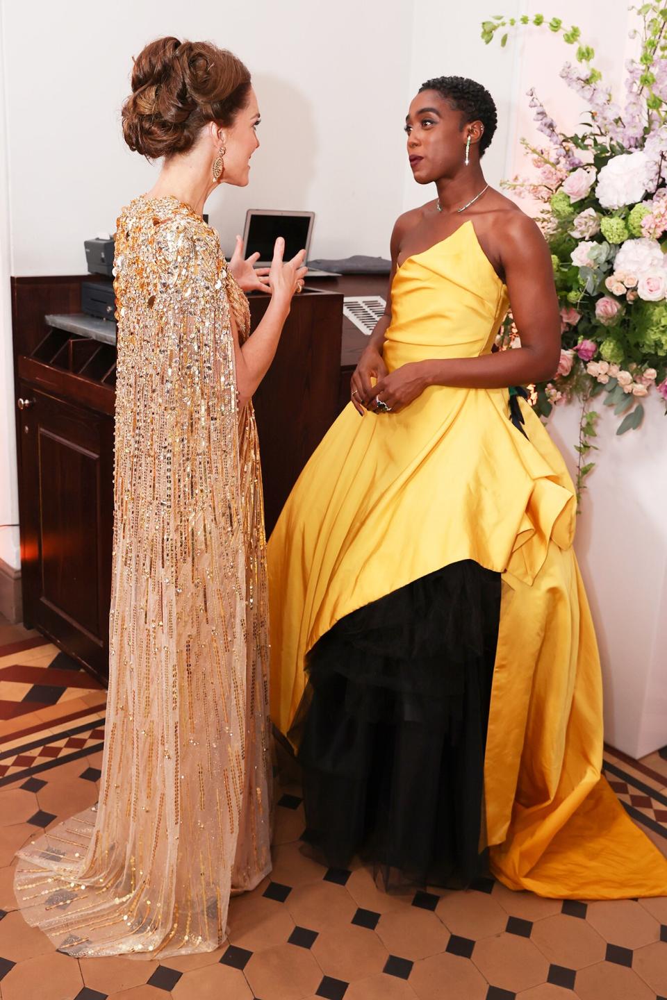 Catherine, Duchess of Cambridge meets some of the cast including Lashana Lynch at the "No Time To Die" World Premiere at Royal Albert Hall on September 28, 2021 in London, England.