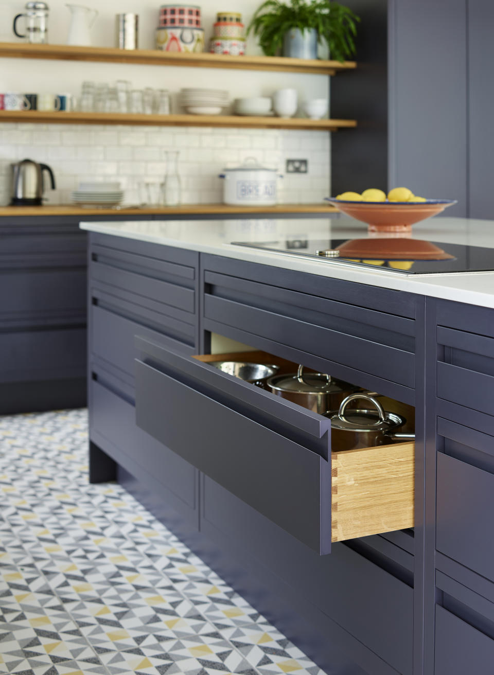 Dark kitchen with dovetail wood drawer by Harvey Jones