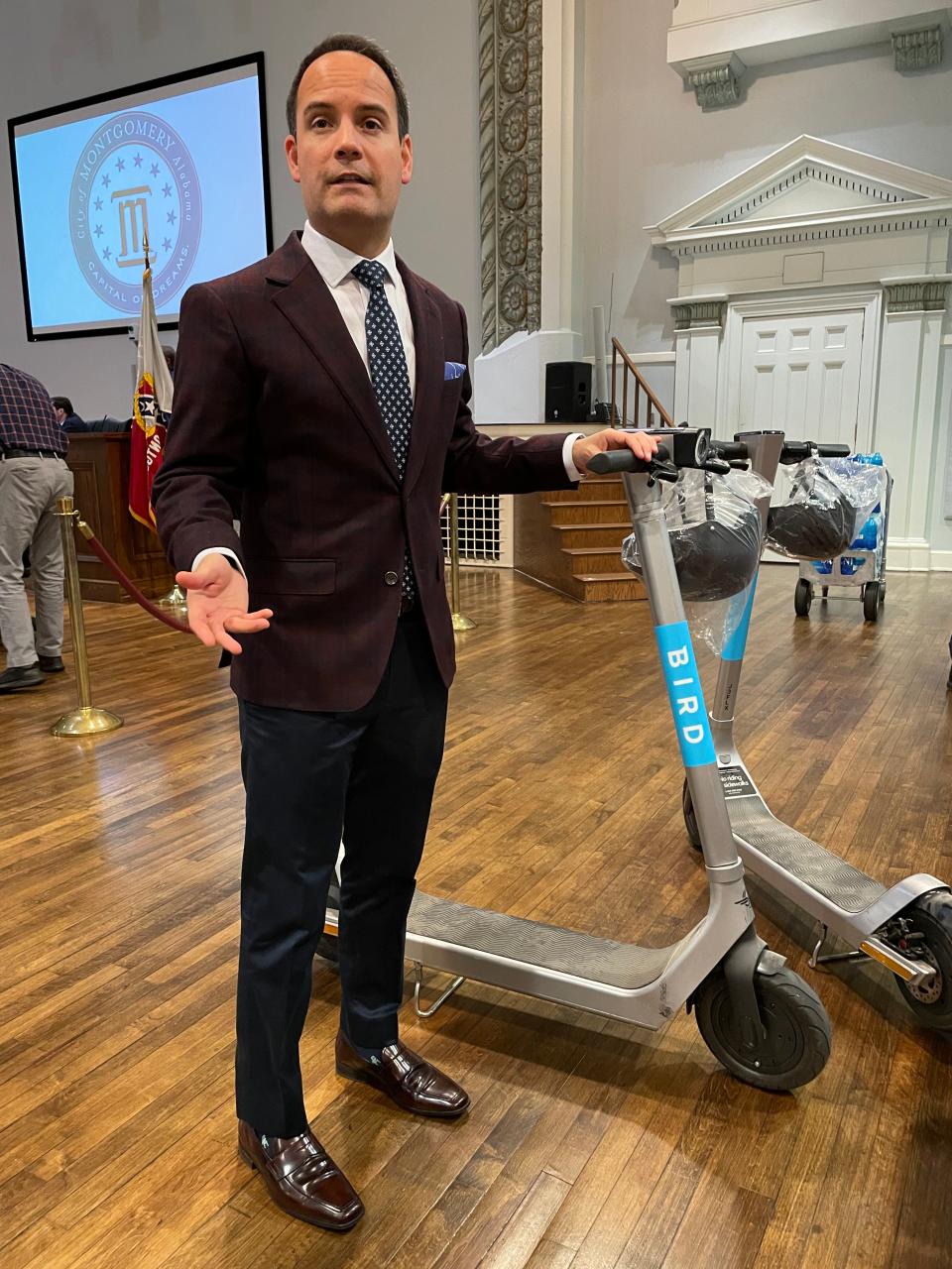 Bird senior manager of government partnerships Bruno Lopes talks about the BirdThree scooter Tuesday at City Hall.