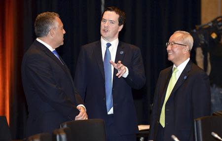 Britain's Chancellor of the Exchequer George Osbourne (C) chats with Australia's Treasurer Joe Hockey (L) and South Korea's Finance Minister Hyun Oh-seok (R) before the G20 Finance Ministers and Central Bank Governors round table meeting in Sydney, February 22, 2014. REUTERS/William West/Pool