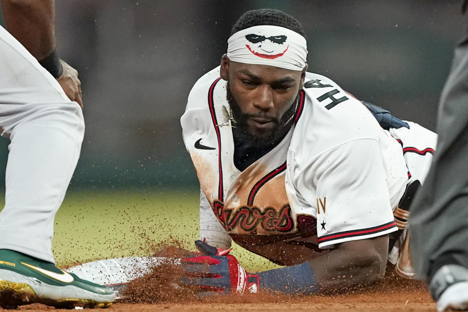 Atlanta Braves' Michael Harris II slides into second base with a double during the seventh inning of the team's baseball game against the Oakland Athletics on Wednesday, June 8, 2022, in Atlanta. (AP Photo/John Bazemore)