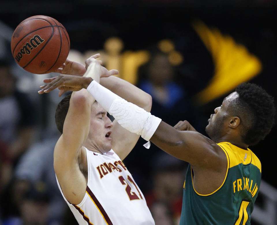 Baylor guard Gary Franklin, right, knocks the ball away from Iowa State guard Matt Thomas (21) during the first half of an NCAA college basketball game in the final of the Big 12 Conference men's tournament in Kansas City, Mo., Saturday, March 15, 2014. (AP Photo/Orlin Wagner)