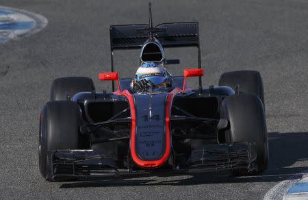 McLaren Formula One racing driver Fernando Alonso of Spain drives his new car MP4-30 during pre-season testing at the Jerez racetrack in southern Spain February 1, 2015. REUTERS/Marcelo del Pozo