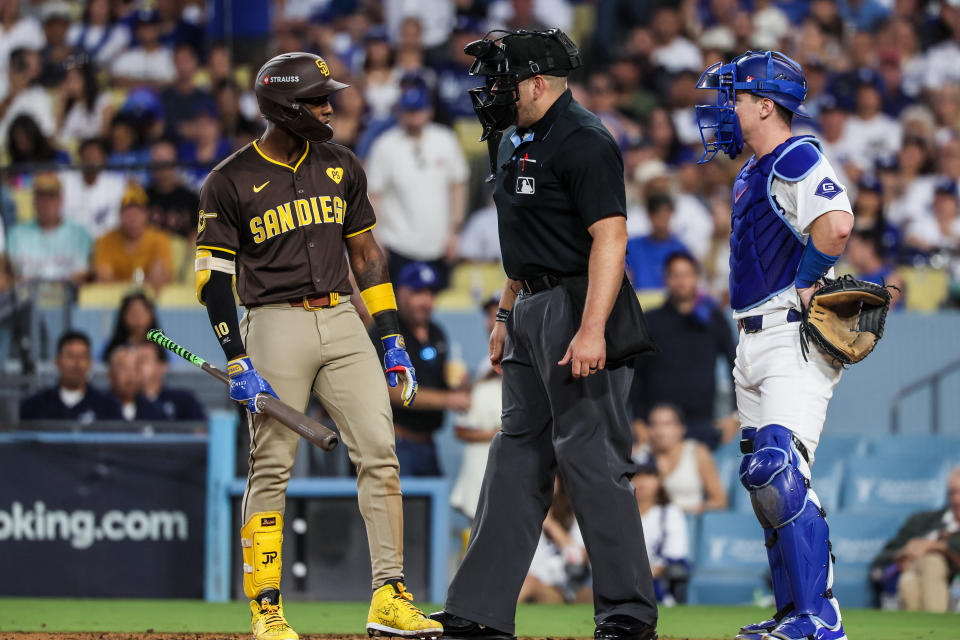 Los Angeles, CA, Sunday, October 6, 2024 - San Diego Padres outfielder Jurickson Profar (10) has words for Los Angeles Dodgers catcher Will Smith (16) when he comes to the plate after teammate Fernando Tatis jr. was hit by a pitch in game two of the National League Division Series at Dodger Stadium. (Robert Gauthier/Los Angeles Times via Getty Images)