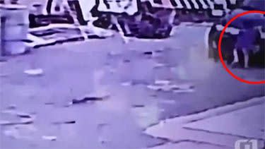 The child gets knocked to the ground by the vehicle, as his unsuspecting mother parks her car in the driveway. Photo: YouTube