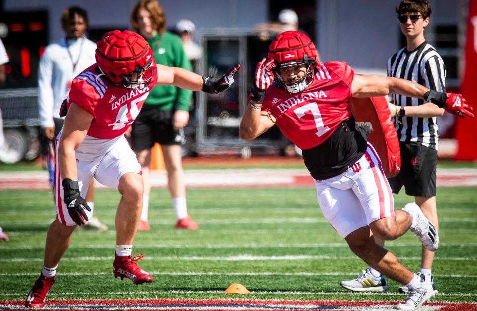 Indiana's E.J. Williams (7) goes against Andrew Turvy (45) in a drill during Indiana football's Spring Football Saturday event at Memorial Stadium on Saturday, April 15, 2203.