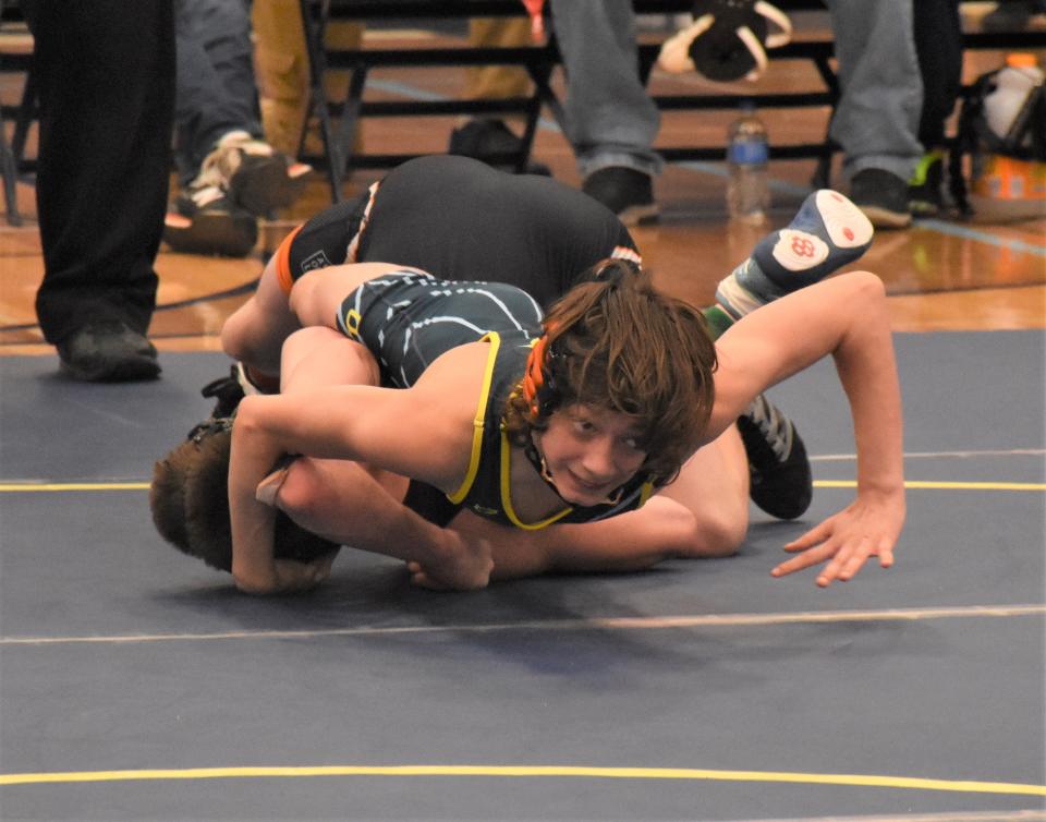 Central Valley Academy eighth-grader Jacob Hurd grapples with Mexico Academy's Noah Becker during the 102-pound championship bout Saturday at the Leo J. Sammon Memorial Tournament in Ilion. Hurd won a 7-2 decision.