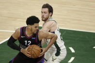 Philadelphia 76ers' Tobias Harris (12) drives to the basket against Milwaukee Bucks' Pat Connaughton during the second half of an NBA basketball game Thursday, April 22, 2021, in Milwaukee. (AP Photo/Aaron Gash)