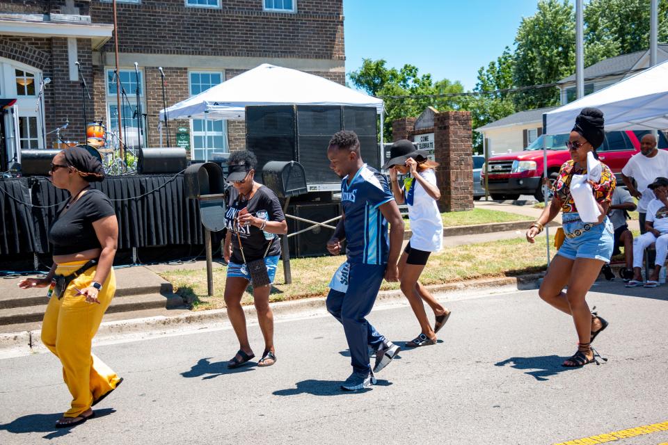 The crowd begins to dance together to music pouring from the stereos on Saturday, June, 18, 2022, during the Juneteenth festival held at Bradley Academy Museum and Cultural Center.