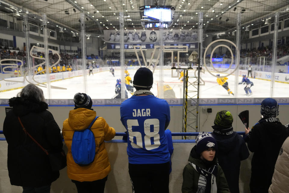 A spectator wearing a jersey of hockey great Jaromir Jagr watches the first Czech hockey league match between Kladno Knights and Ceske Budejovice in Kladno, Czech Republic, Sunday, Jan. 21, 2024. Jaromir Jagr will have to miss a game or two while he's in Pittsburgh to see his No. 68 jersey raising to the rafters at PPG Paints Arena. Just three days after the right-winger turns 52, the Penguins will retire two-time Stanley Cup champion's number at a pre-game ceremony on Sunday Feb. 18, 2024. (AP Photo/Petr David Josek)