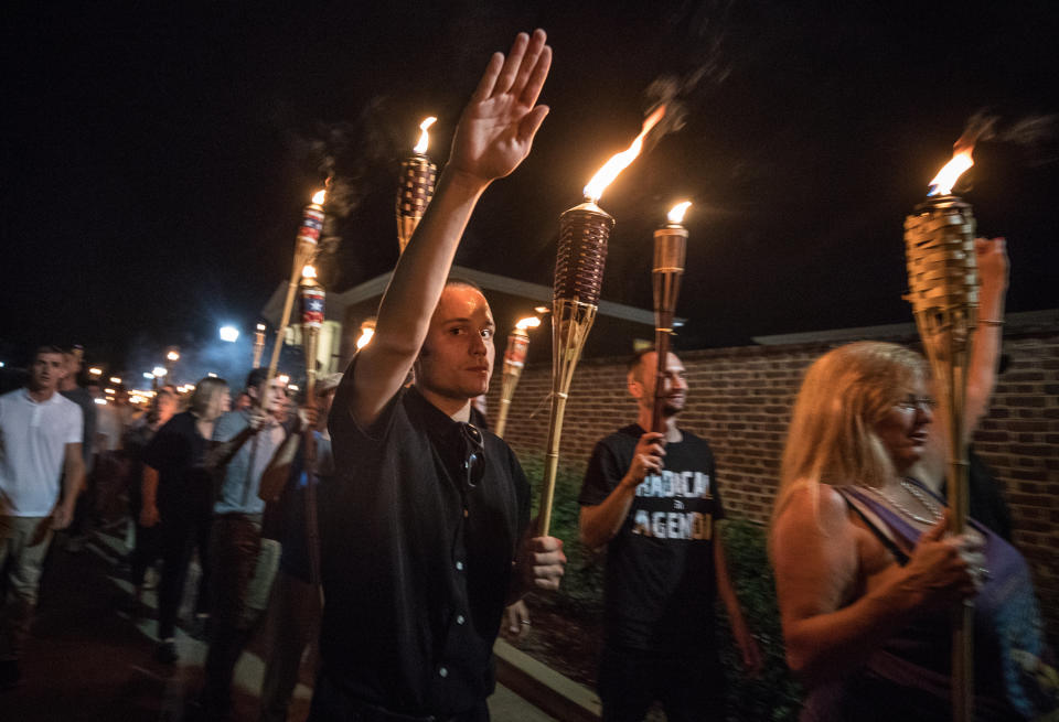 White nationalists and white supremacists carrying torches march through the University of Virginia campus on Aug. 11, 2017. (Photo: Evelyn Hockstein / The Washington Post via Getty Images)