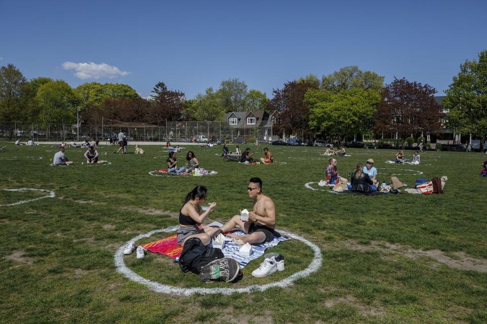 People use social distancing circles at Trinity Bellwoods Park in Toronto in May 2021. THE CANADIAN PRESS/Cole Burston