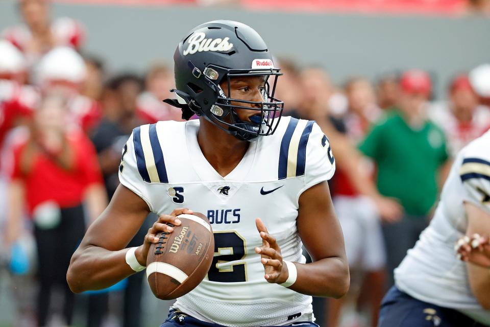 Charleston Southern's Isaiah Bess (2) looks to pass the ball during the second half of an NCAA college football game against the North Carolina State in Raleigh, N.C., Saturday, Sept. 10, 2022. (AP Photo/Karl B DeBlaker)