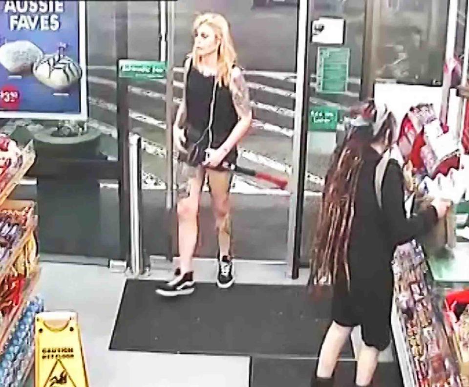 Amati enters the 7-Eleven with an axe in his hand and strikes Benjamin Rimmer in the face and Sharon Hacker (right) in the back. Source: AAP / NSW District Court