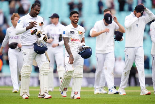 Sri Lanka’s Pathum Nissanka (right) leaves the field with Angelo Mathews 