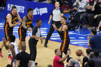 Atlanta Hawks' Trae Young, right, reacts to a call during the second half of Game 7 in a second-round NBA basketball playoff series against the Philadelphia 76ers, Sunday, June 20, 2021, in Philadelphia. (AP Photo/Matt Slocum)