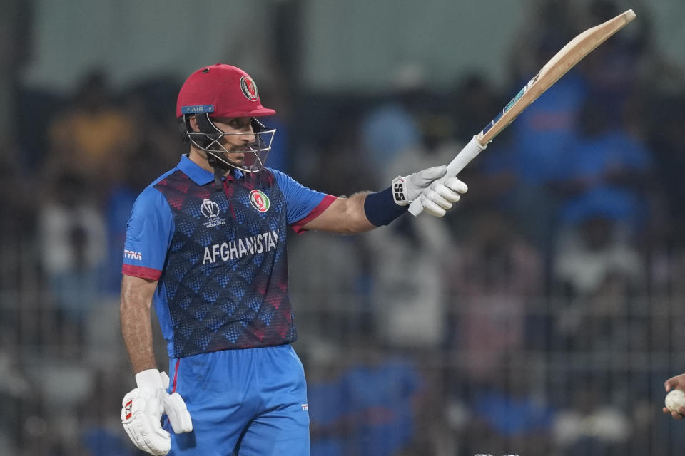 Afghanistan's Rahmat Shah celebrates his fifty runs during the ICC Men's Cricket World Cup match between Pakistan and Afghanistan in Chennai, India, Monday, Oct. 23, 2023. (AP Photo/Eranga Jayawardena)