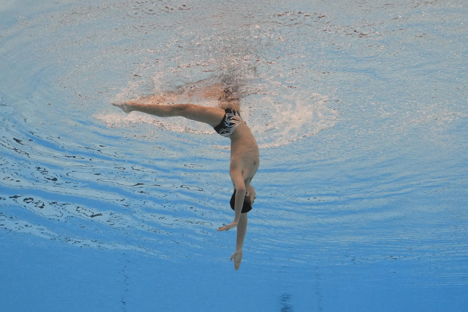 Yang Shuncheng of China competes in the men's solo technical final of artistic swimming at the World Aquatics Championships in Doha, Qatar, Monday, Feb. 5, 2024. (AP Photo/Lee Jin-man)
