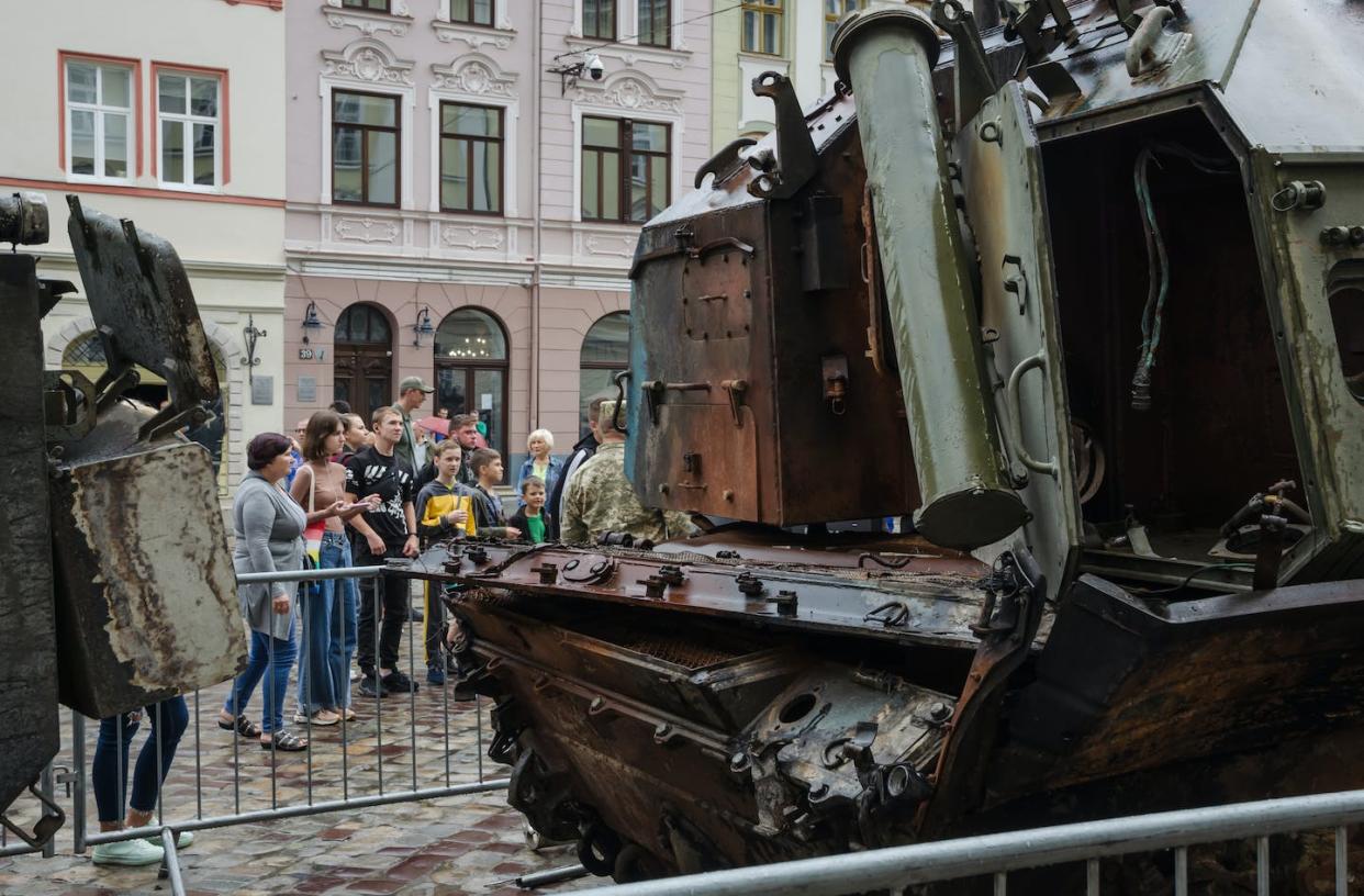 People attend an exhibition of Russian equipment destroyed by the armed forces of Ukraine, in Lviv, Ukraine, Aug. 11, 2022. <a href="https://www.gettyimages.com/detail/news-photo/people-attend-the-opening-of-the-exhibition-of-russian-news-photo/1242453575?adppopup=true" rel="nofollow noopener" target="_blank" data-ylk="slk:Olena Znak/Anadolu Agency via Getty Images;elm:context_link;itc:0;sec:content-canvas" class="link ">Olena Znak/Anadolu Agency via Getty Images</a>