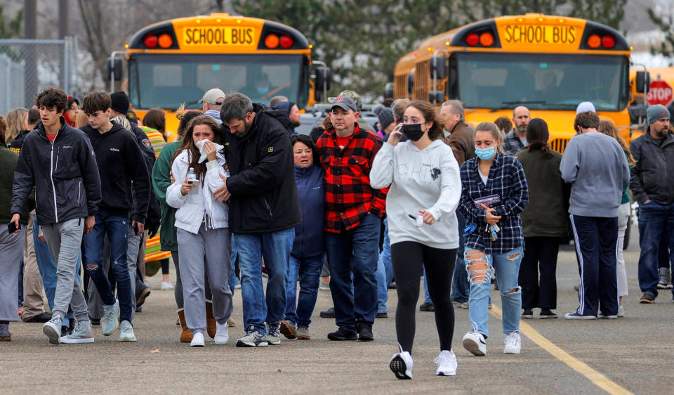 Image: Parents leave with students after Oxford High School Shooting (Eric Seals / USA TODAY NETWORK via Reuters)
