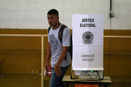 A man leaves a booth after casting his vote during the municipal elections in Rio de Janeiro, Brazil, October 30, 2016. REUTERS/Pilar Olivares