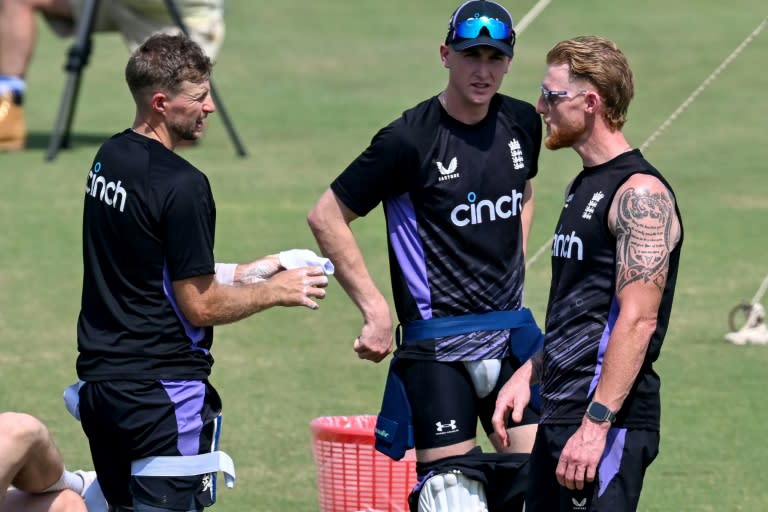 England's captain Ben Stokes (R) with teammates Joe Root (L) and Harry Brook (C) attend a practice session at the Multan Cricket Stadium (Aamir QURESHI)