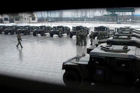 Soldiers of Kosovo Security Force stand next to their vehicles after the army formation ceremony in Pristina, Kosovo, December 14, 2018. REUTERS/Laura Hasani