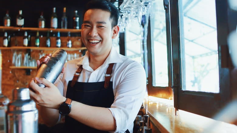 bartender shaking a cocktail