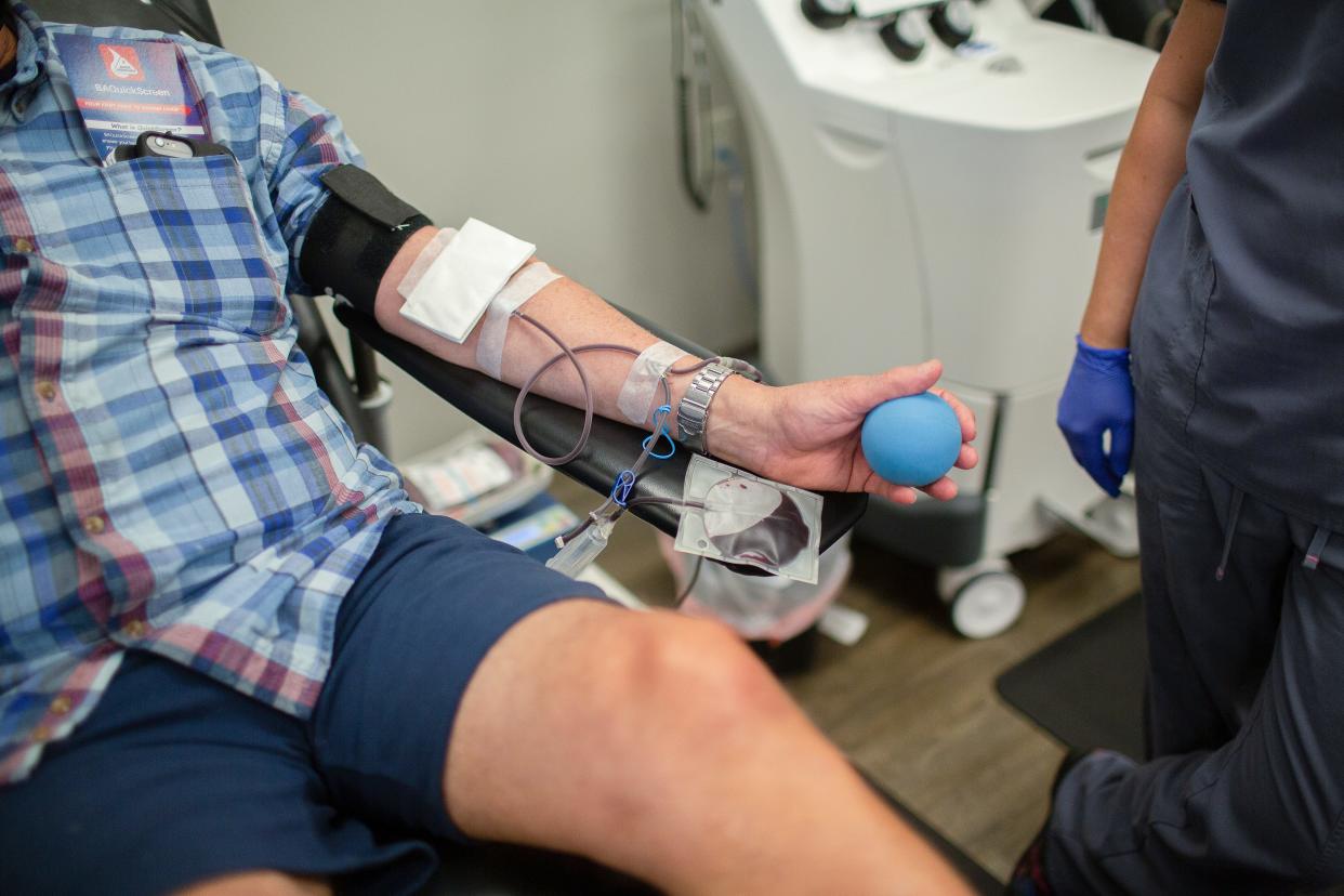 A member of the community gives blood at Blood Assurance donation center in Columbia, Tenn., on Tuesday,  Aug. 17, 2021. 