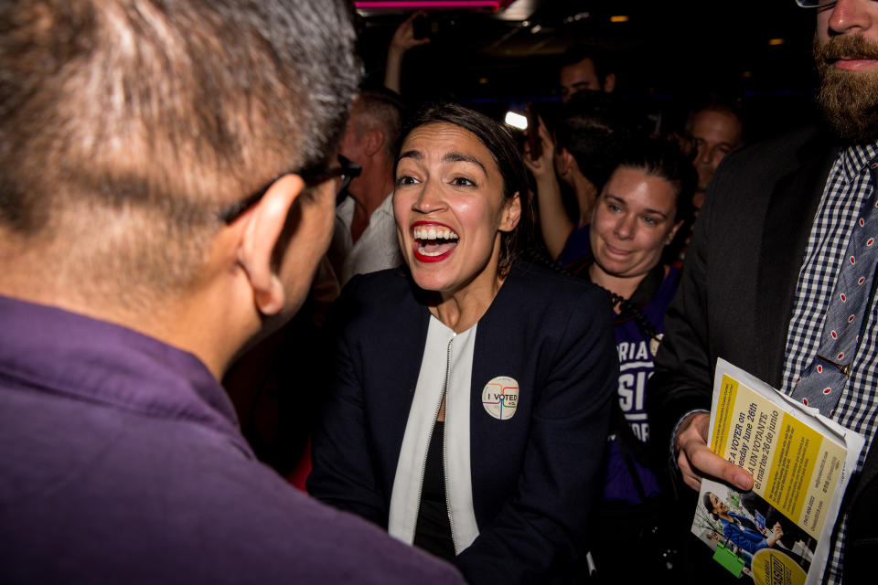 Alexandria Ocasio-Cortez celebrating her election victory with supporters.